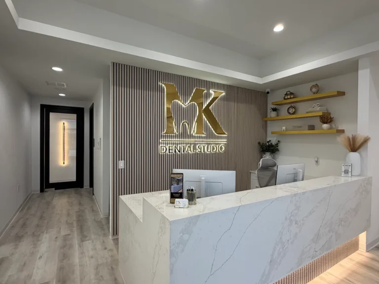 Deep cleaning visits start at the reception desk of MK Dental Studio in Fulshear, TX